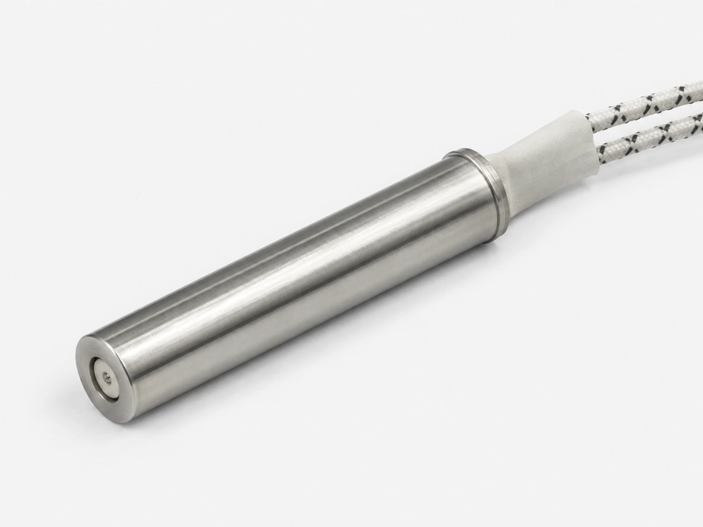 Cutaway view showing the metal sheath, ceramic insulation and lead connection of a cartridge heater
