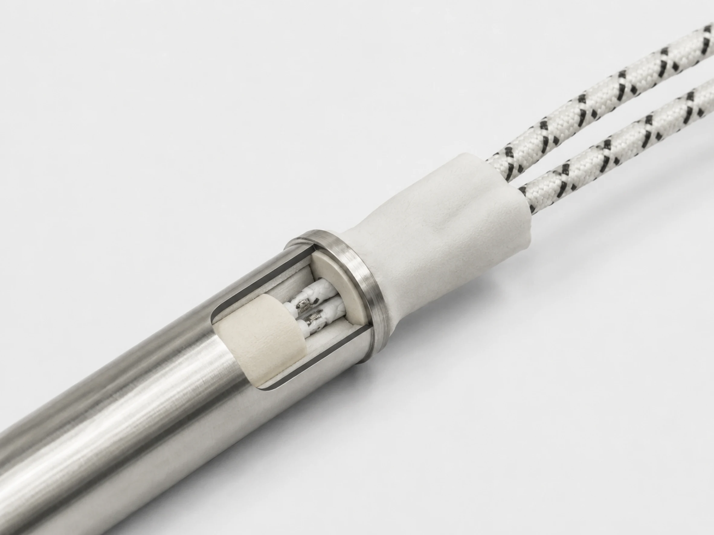 Heat-resistant insulated leads and sealed lead exit of an industrial cartridge heater